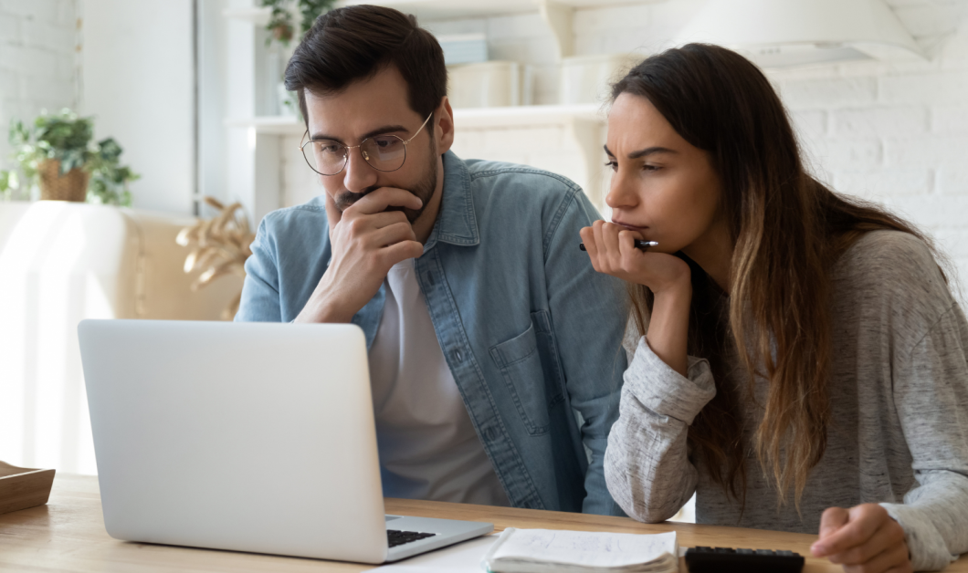 A couple looking at computer